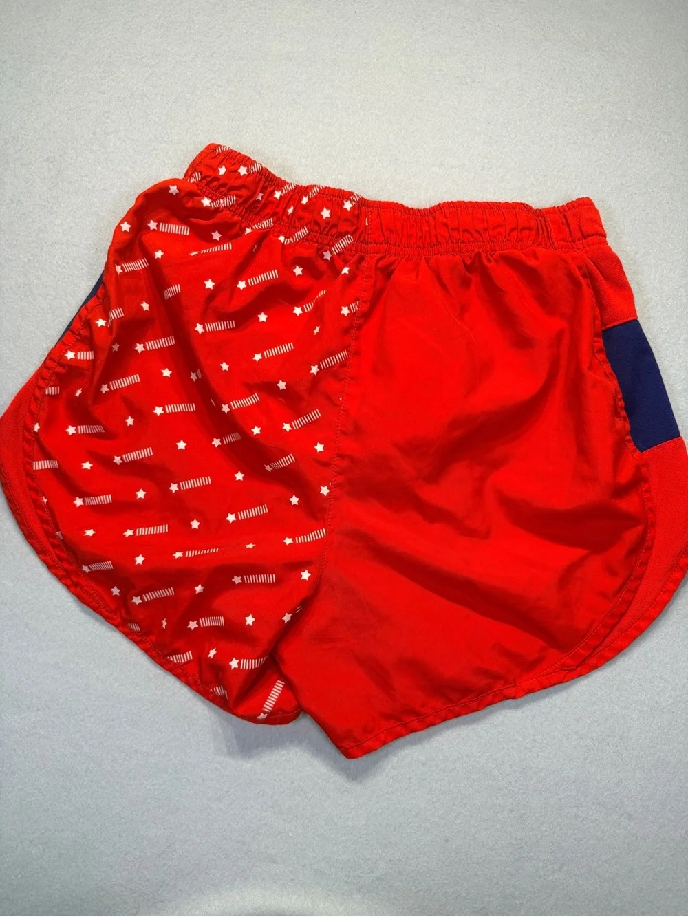 Nike Women's Red Athletic Shorts with Navy Panels and Star Print size S